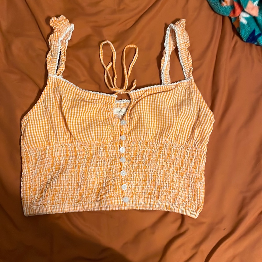 buttons and tie in front, ruffled straps
